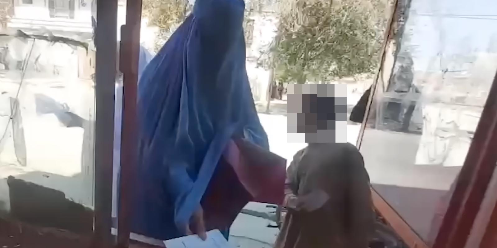 A family present vouchers to collect bread at a local bakery