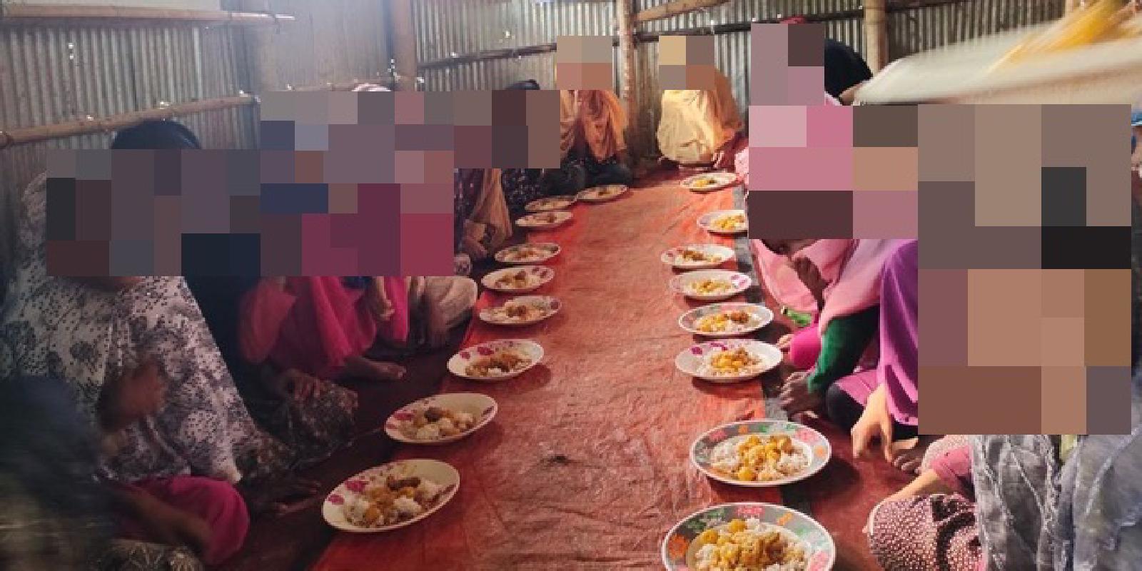 Girls receive meals at a shelter overseen by Lonely Orphans
