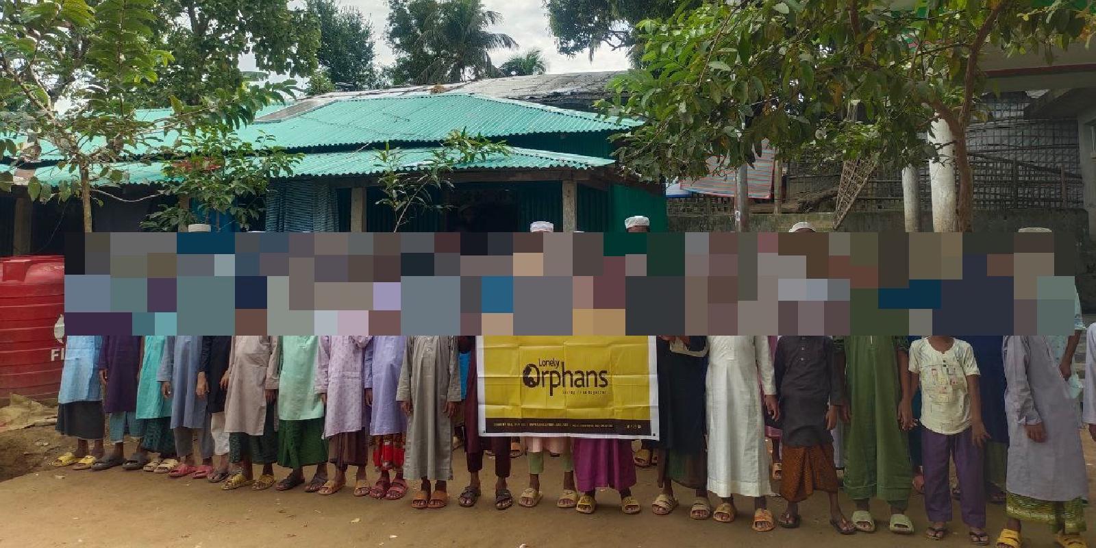 Boys line up for a photo at a shelter overseen by Lonely Orphans