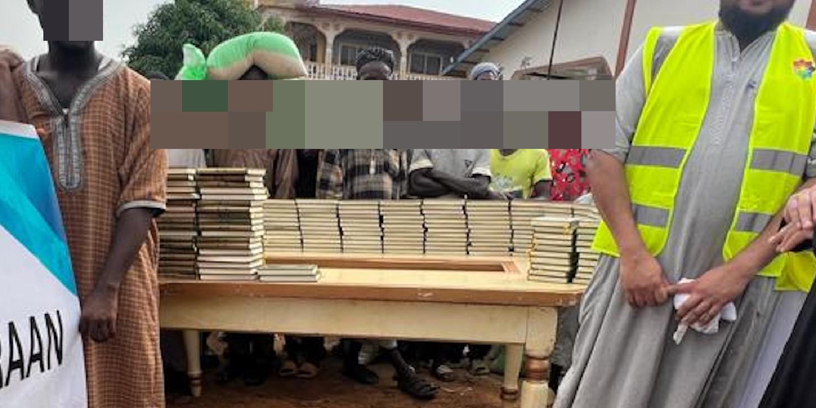 Volunteers ready copies of the Quran for distribution at a village in Waterloo