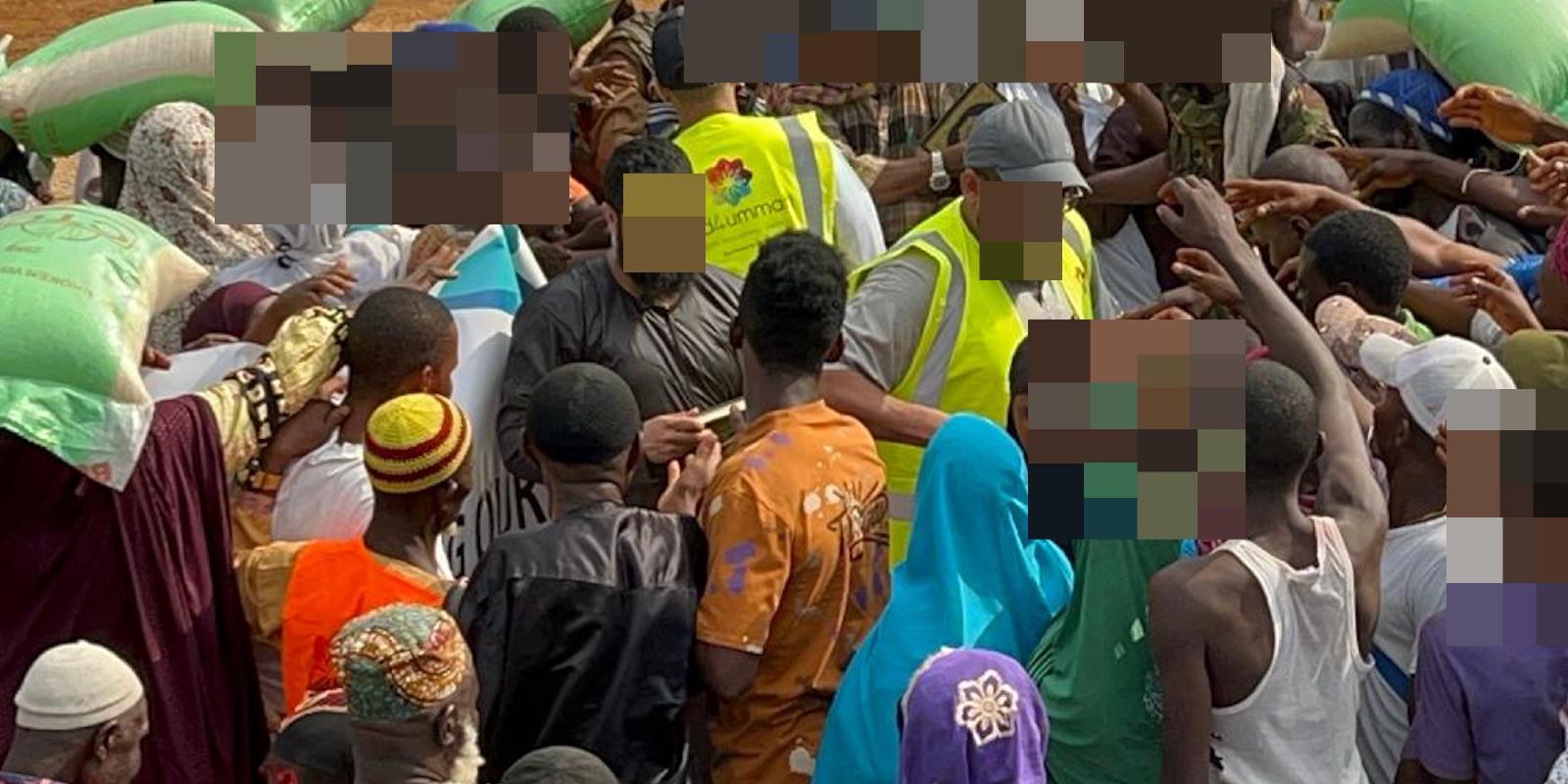 Locals crowd to receive copies of the Quran at a village in Waterloo