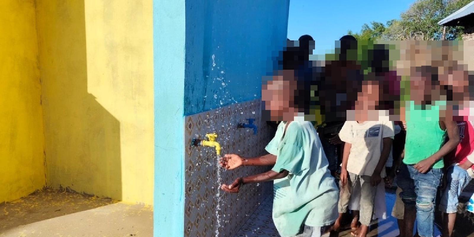 Children playfully inspect the new installation